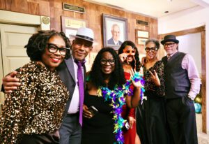 Group of festive dressed folks at the Front Steps Elevation Gala in 2024