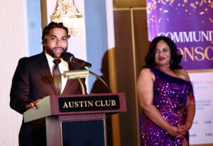 Man and Woman on Stage at the Front Steps Gala presenting